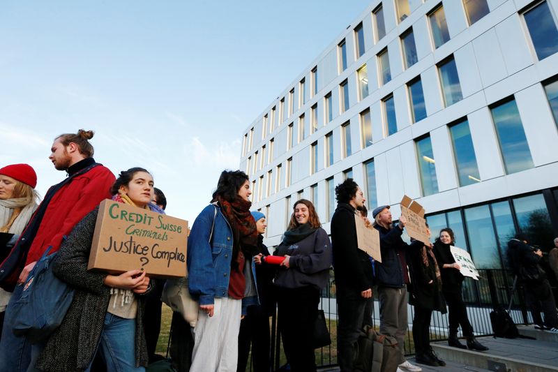 Activists protest outside the District Court of West Lausanne before the trial of twelve