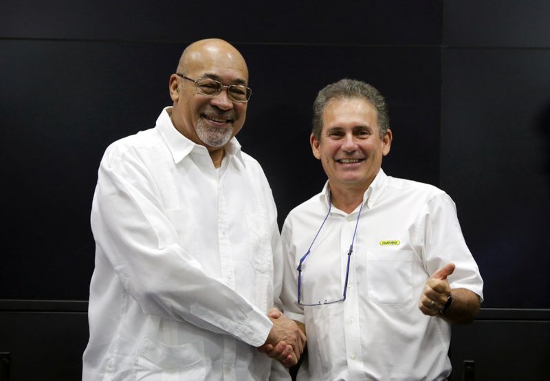 Suriname's President Desi Bouterse reacts during a news conference while announcing that Apache