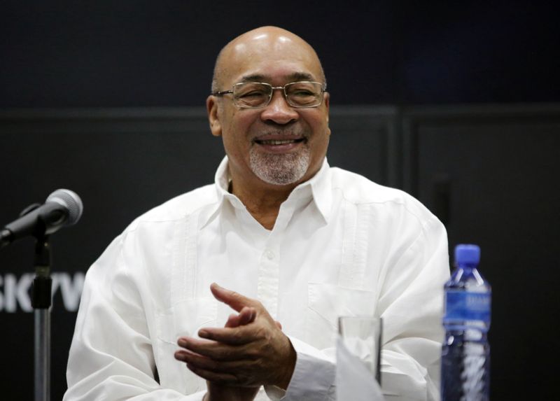 Suriname's President Desi Bouterse reacts during a news conference while announcing that Apache