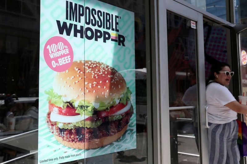 FILE PHOTO: A sign advertising the soy based Impossible Whopper is seen outside a Burger King
