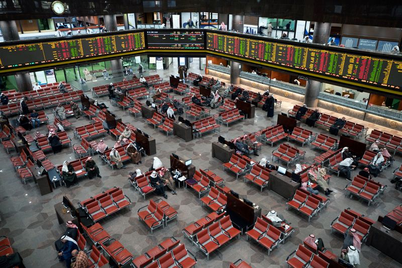 An investor walks through the Dubai Financial Market in Dubai