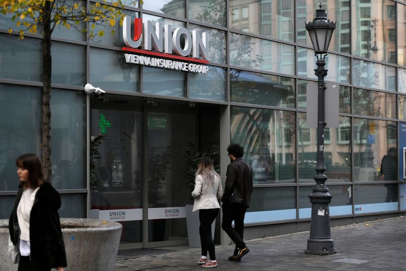 People enter HQ of insurance company Union in Budapest