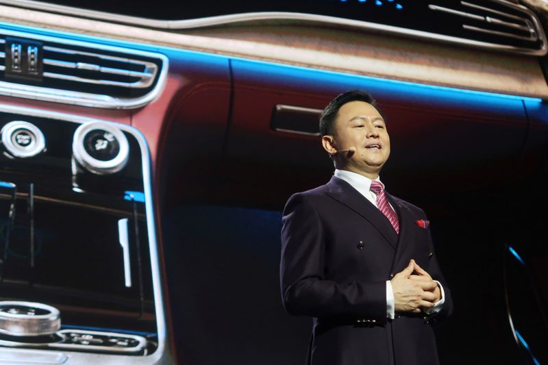 Xu Liuping, chairman of China's FAW Group, speaks at an event of Chinese car marque Hongqi, or