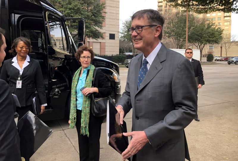 FILE PHOTO: Federal Reserve Vice Chairman Clarida boards a bus to tour South Dallas as part of