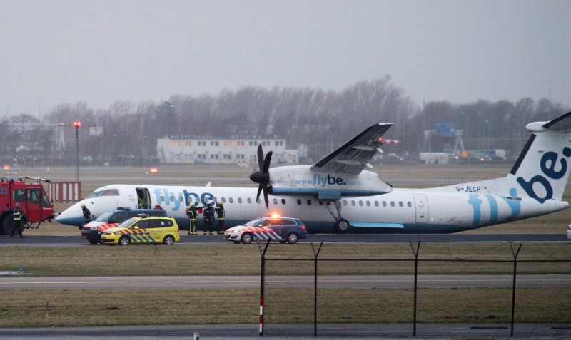 FILE PHOTO: A plane of FlyBe airlines is seen of the runway of Schiphol airpoprt after landing