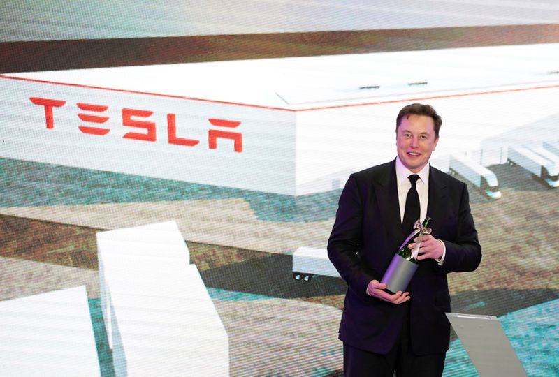 FILE PHOTO: Tesla Inc CEO Elon Musk attends an opening ceremony for Tesla China-made Model Y