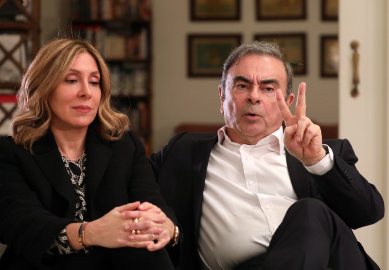 Former Nissan chairman Carlos Ghosn and his wife Carole Ghosn pose for a picture after an