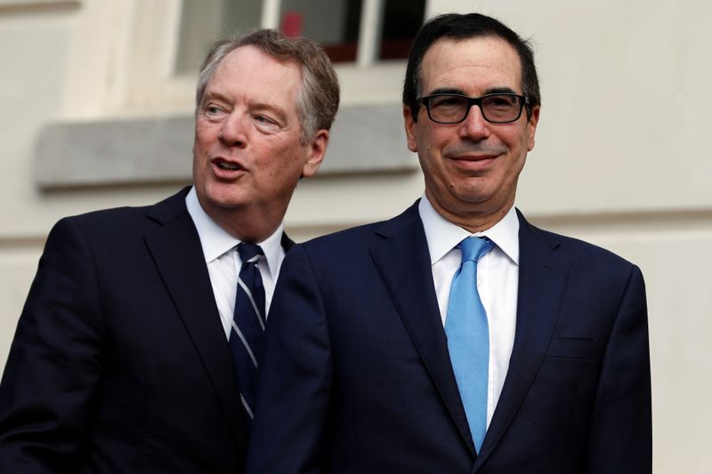 FILE PHOTO:  U.S. Treasury Secretary Steve Mnuchin greets China's Vice Premier Liu He