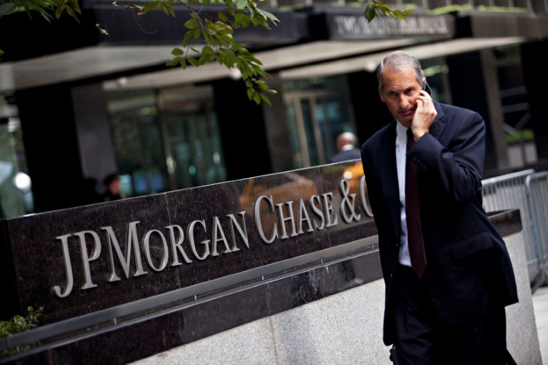 FILE PHOTO: Man walks past JP Morgan Chase's international headquarters on Park Avenue in New