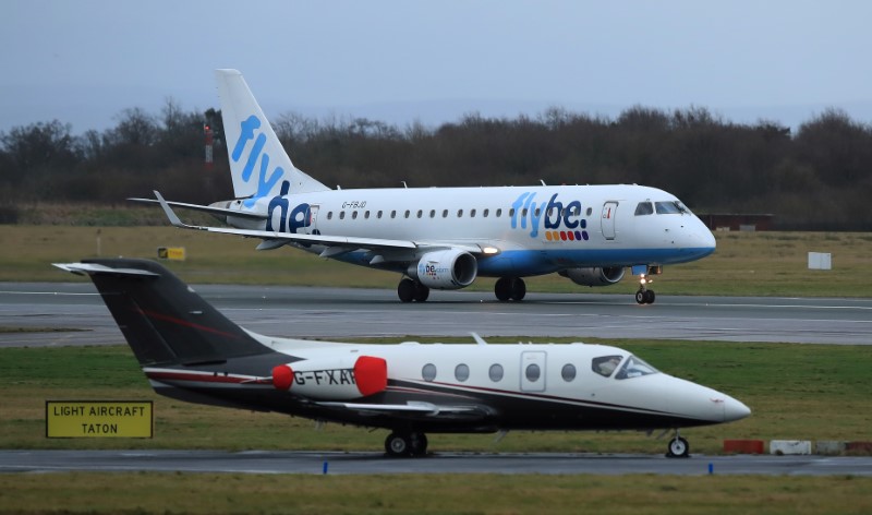 FILE PHOTO: A Flybe plane takes off from Manchester Airport in Manchester, Britain