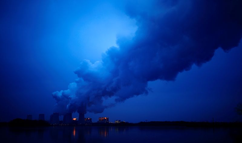 FILE PHOTO: Water vapour rises from the cooling towers of the Jaenschwalde lignite-fired power