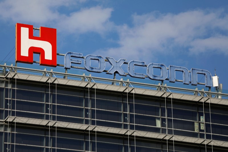 FILE PHOTO: The logo of Foxconn, the trading name of Hon Hai Precision Industry, is seen on top
