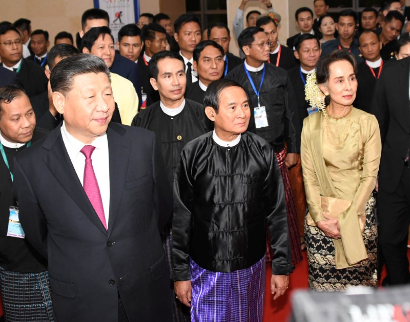 Chinese President Xi Jinping and Myanmar State Counselor Aung San Suu Kyi attend a signing