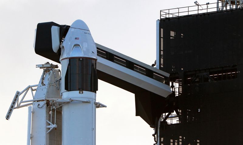The SpaceX Crew Dragon sits atop a Falcon 9 booster rocket on Pad 39A at Kennedy Space Center