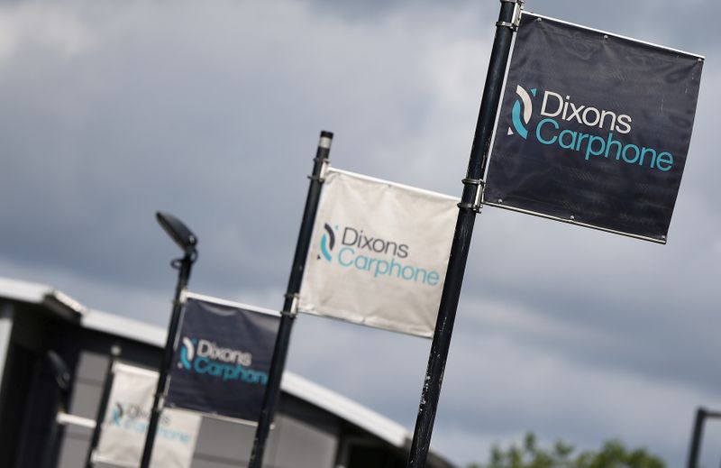FILE PHOTO: Signs display the logo of Dixons Carphone at the company headquarters in London