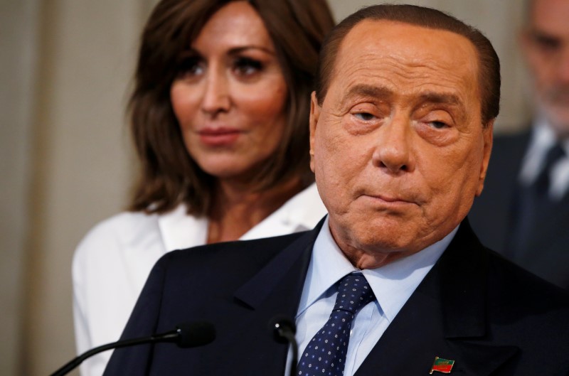 FILE PHOTO: Forza Italia leader Silvio Berlusconi, speaks to the media after consultations with