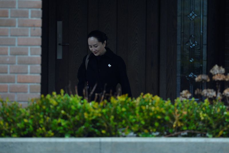 Huawei CFO Meng leaves her home to attend her extradition hearing in Vancouver