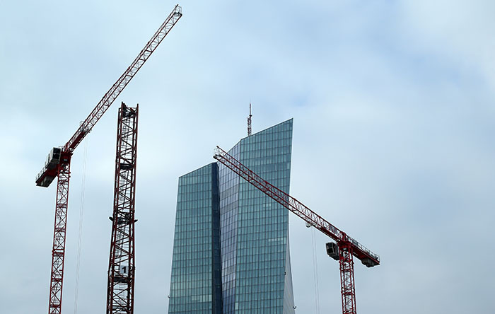 Specialists work on a crane in front of the European Central Bank (ECB) in Frankfurt