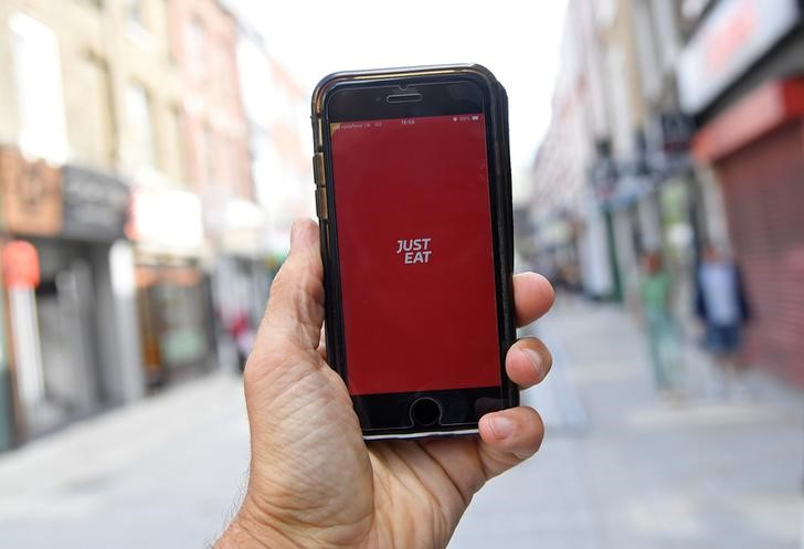 FILE PHOTO: The app for Just Eat is displayed on a smartphone, in London
