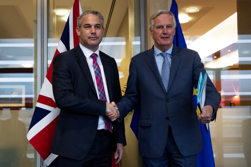FILE PHOTO:  Britain's Brexit Secretary Barclay poses with EU's chief Brexit negotiator Barnier