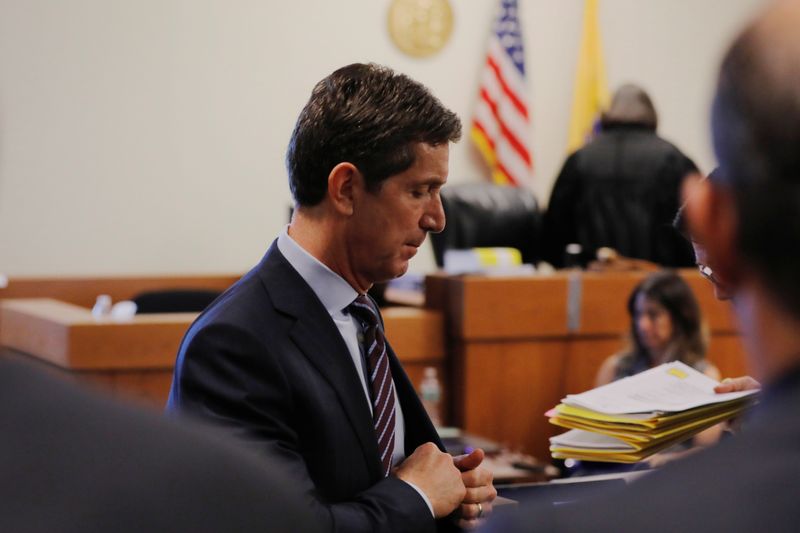 Alex Gorsky, chairman and CEO of Johnson & Johnson, walks out of the courtroom after taking the