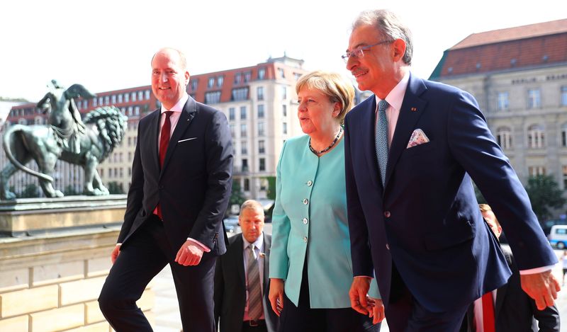 BDI president Kempf and Director General Lang welcome German Chancellor Merkel to the German