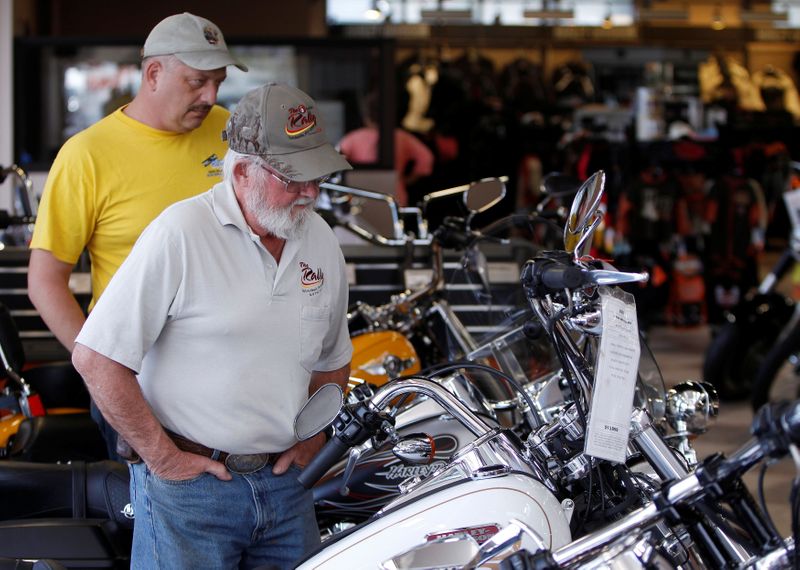 FILE PHOTO: Customers look at the showroom inventory at Harley-Davidson of Frederick in