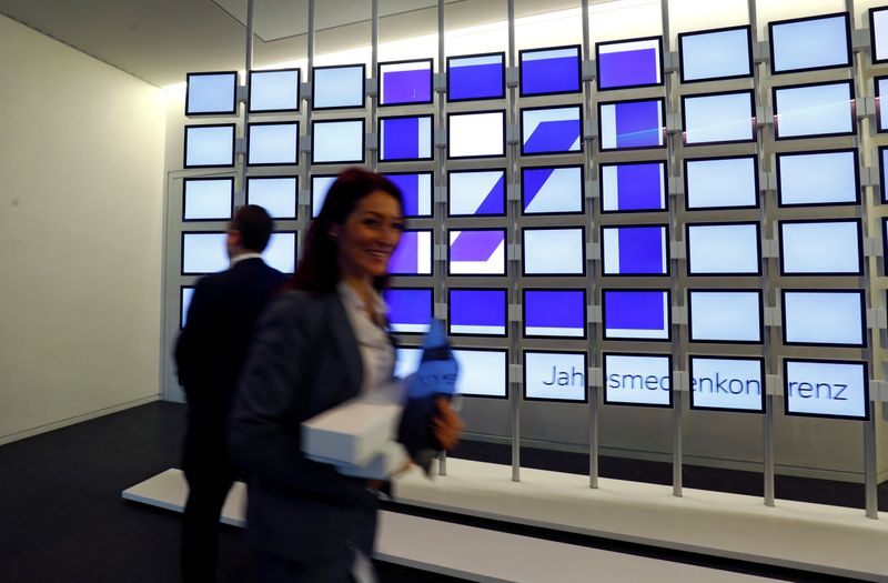 FILE PHOTO: The logo of Deutsche Bank is pictured on a company's office in London