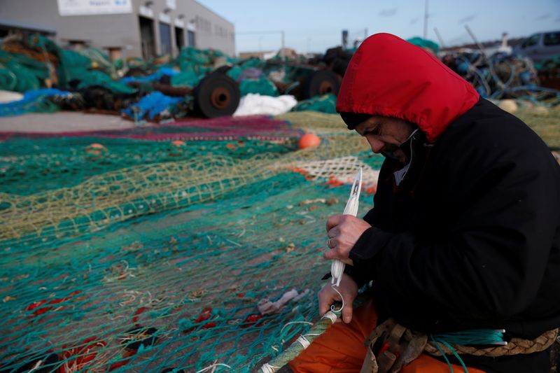French fisherman Alexandre Fournier poses in front of the French trawler 