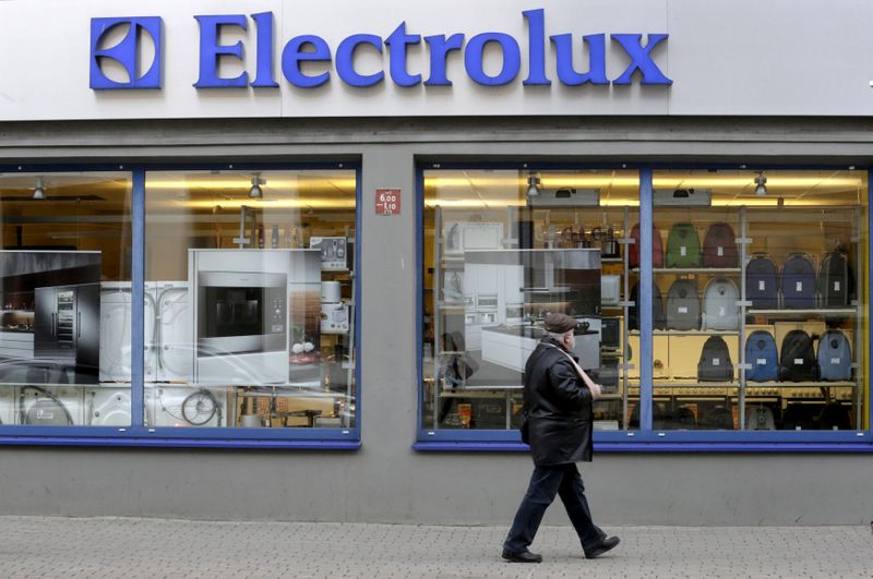FILE PHOTO: A man walks past an Electrolux shop in Riga