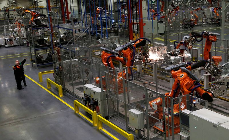 FILE PHOTO: Robots work on a 2013 Mini at BMW's plant in Oxford, southern England