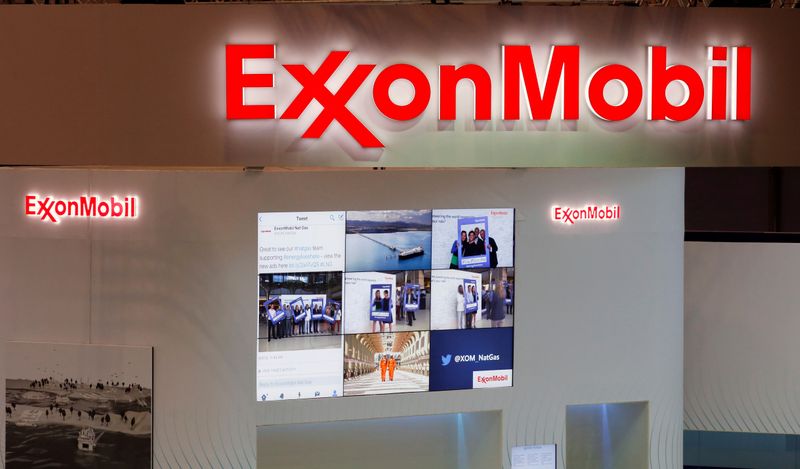 FILE PHOTO: Logos of ExxonMobil are seen in its booth at Gastech, the world's biggest expo for