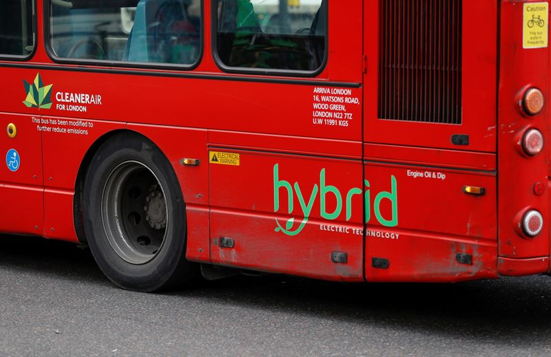 A hybrid sign on the side of a bus is pictured in London