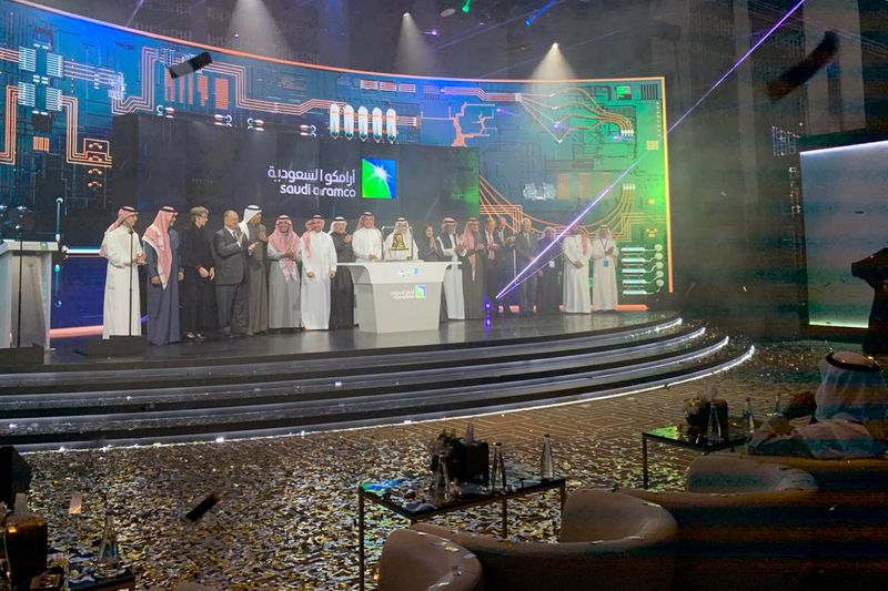 FILE PHOTO: Participants attend the official ceremony marking the debut of Saudi Aramco's IPO