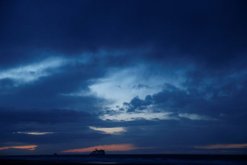 A P&O ferry heads the French port of Calais , in Sangatte