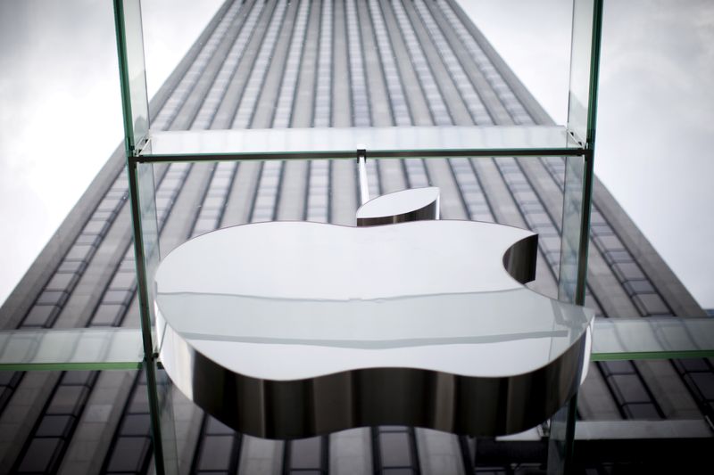 FILE PHOTO: An Apple logo hangs above the entrance to the Apple store on 5th Avenue in the