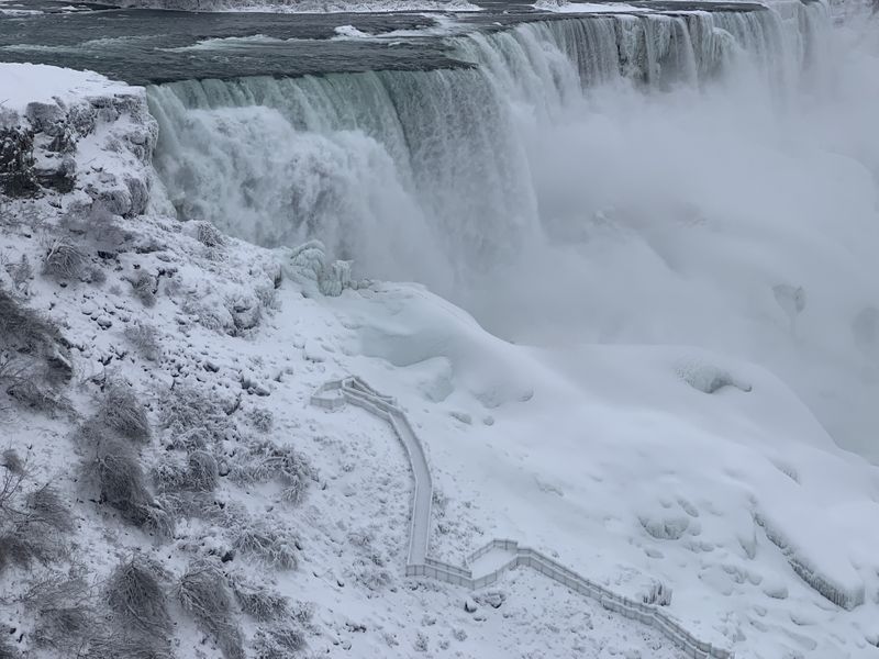 FILE PHOTO: An aerial photo taken over the American side shows water flowing around ice due to