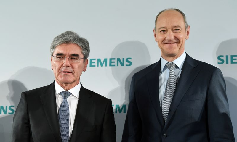 German engineering group Siemens CEO Joe Kaeser and deputy CEO Roland Busch attend a news