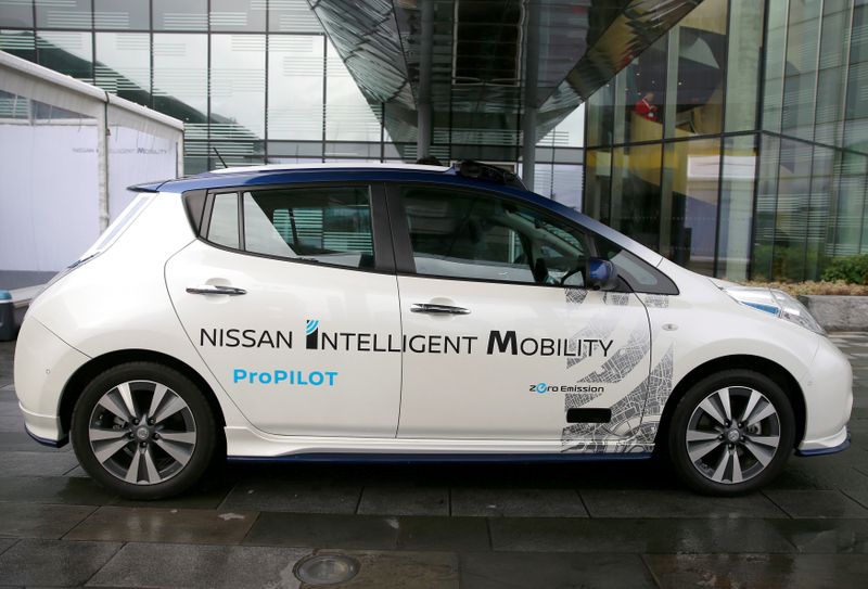 FILE PHOTO: A modified Nissan Leaf, driverless car, is seen during a pause in its first