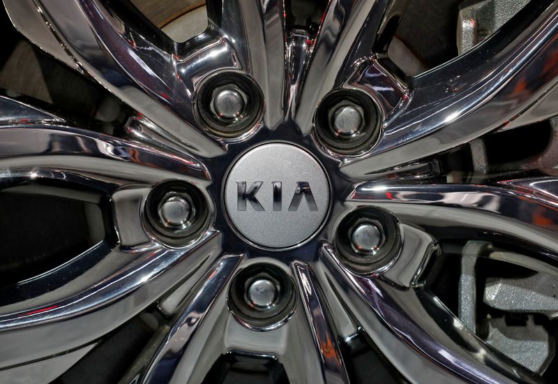 The logo of Kia Motors is seen on a wheel of its Carnival car at the India Auto Expo 2020 in