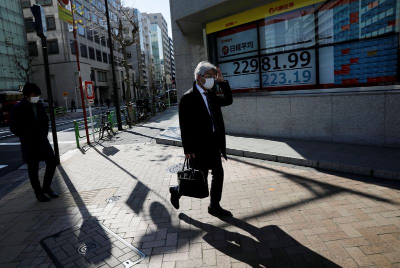 FILE PHOTO: A trader works at Frankfurt's stock exchange in Frankfurt