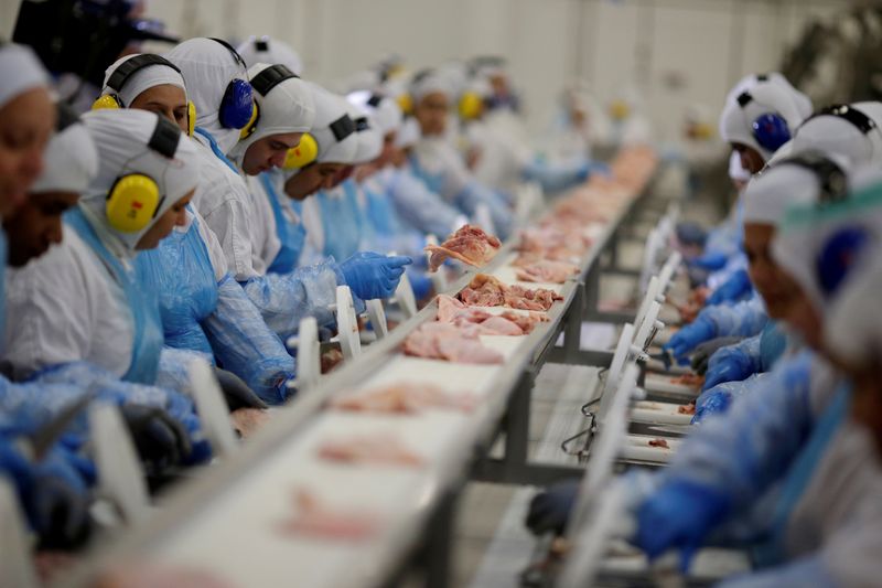 FILE PHOTO: Employees are seen during a technical visit of Brazil's Agriculture Minister Blairo