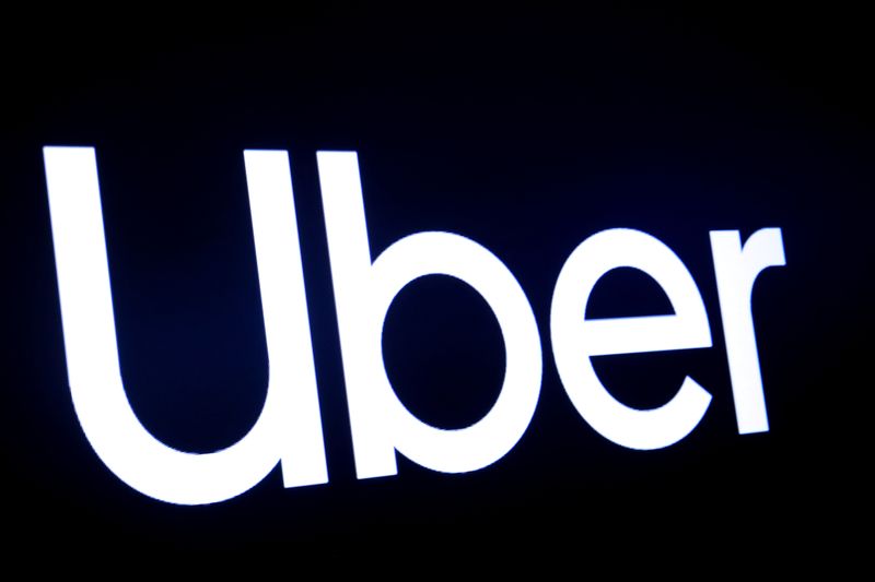 FILE PHOTO: A screen displays the company logo for Uber Technologies Inc on the day of its IPO