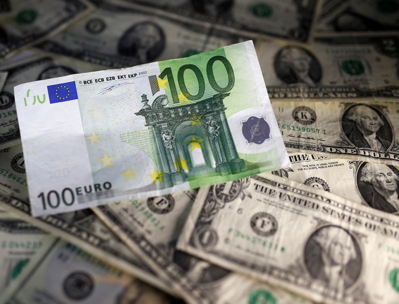 U.S. dollar and Euro notes are seen in this picture illustration