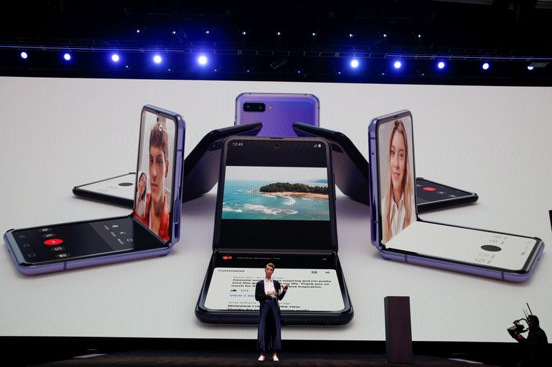 Rebecca Hirst of Samsung Electronics unveils the Z Flip foldable smartphone during Samsung