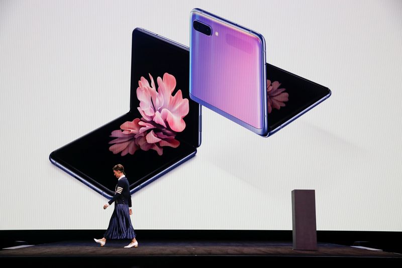 Rebecca Hirst of Samsung Electronics unveils the Z Flip foldable smartphone during Samsung