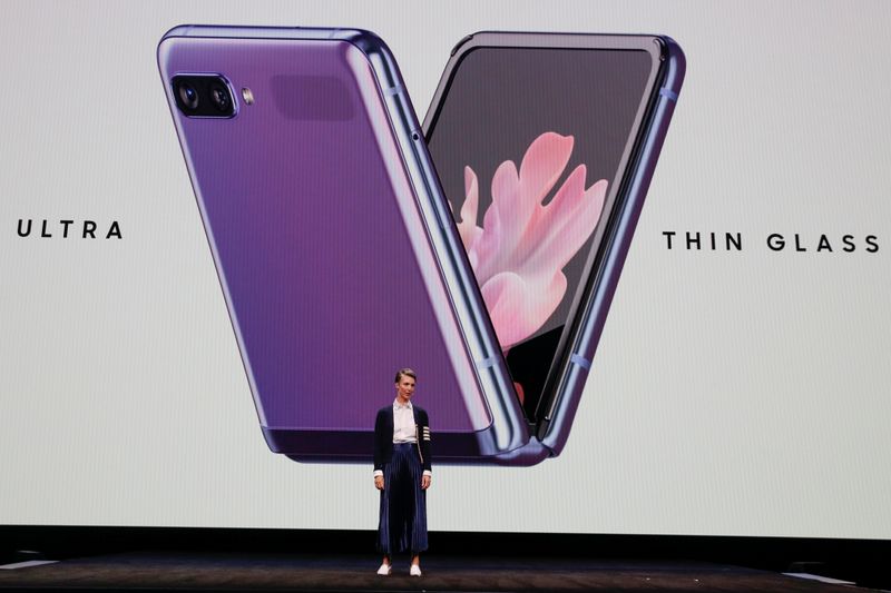 Rebecca Hirst of Samsung Electronics unveils the Z Flip foldable smartphone during Samsung