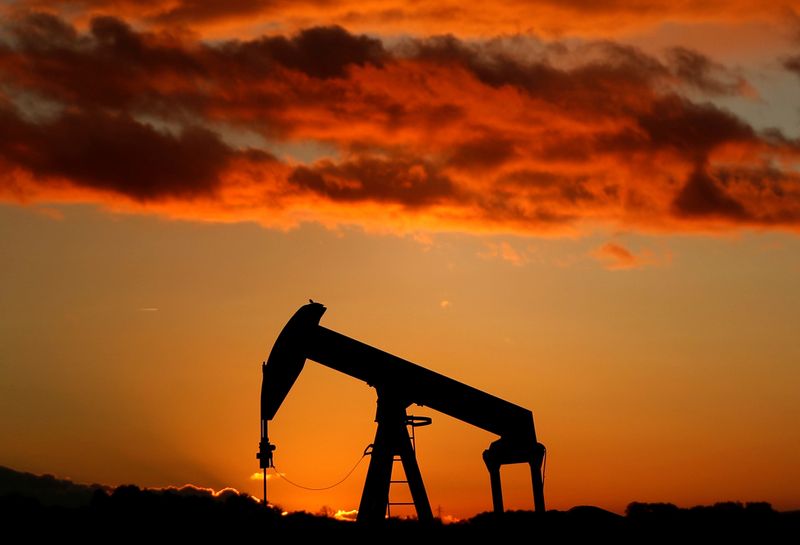 FILE PHOTO: A oil pump is seen at sunset outside Scheibenhard