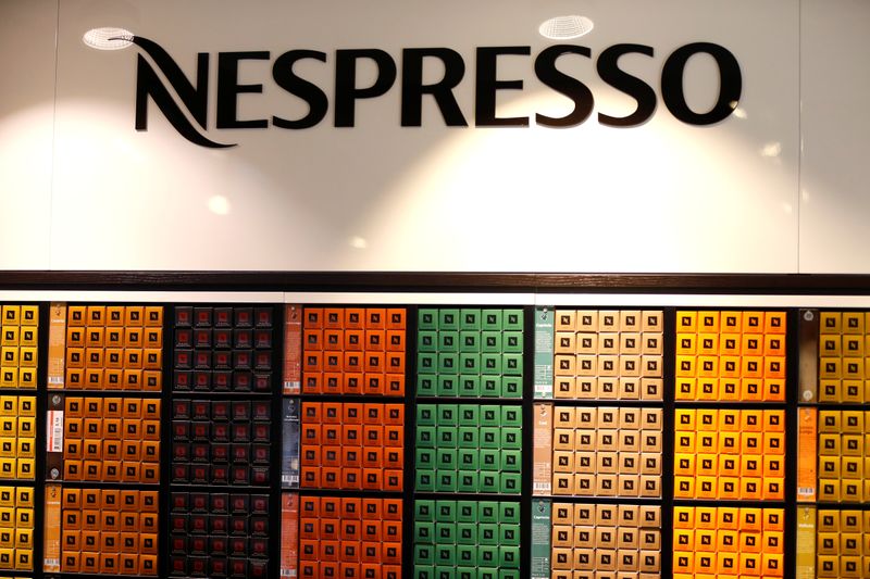 The Nespresso logo and boxes of Nespresso coffee pods are pictured in the supermarket of Nestle