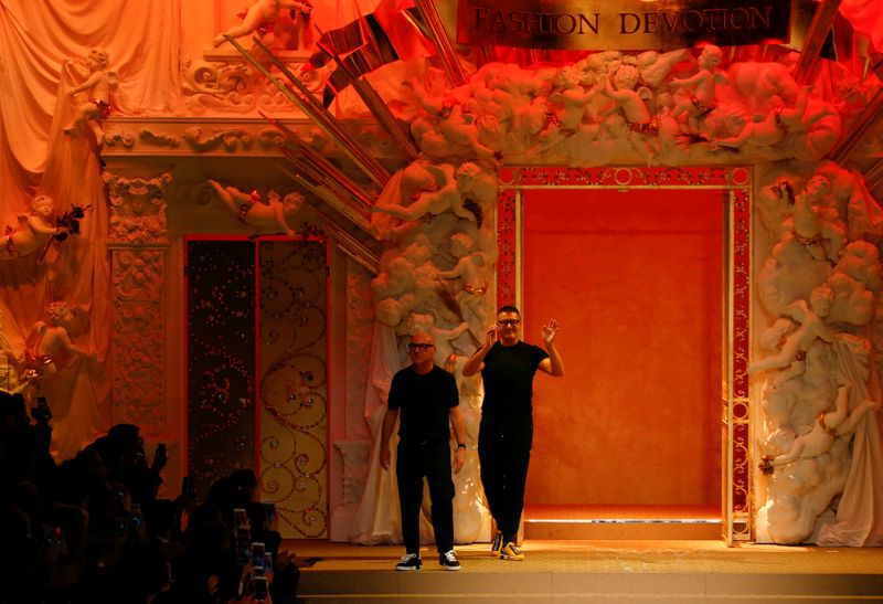 FILE PHOTO:  Italian designers Domenico Dolce and Stefano Gabbana acknowledge the applause at